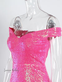 a mannequin wearing a pink dress with sequins