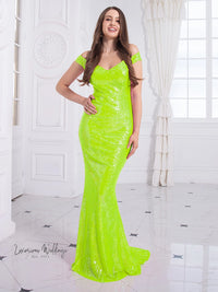 a woman in a neon green dress posing for a picture