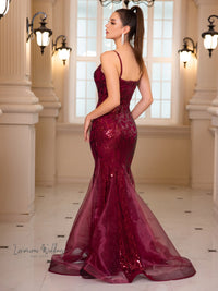 a woman in a red dress standing in a room