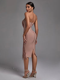 a woman wearing a dress with a high slit