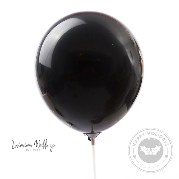 a black balloon with a string attached to it