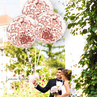 a bride and groom holding balloons in their hands