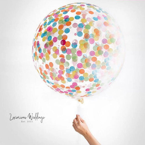 a person holding a balloon with a lot of dots on it