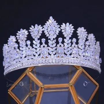 a diamond tiara is displayed on a stand