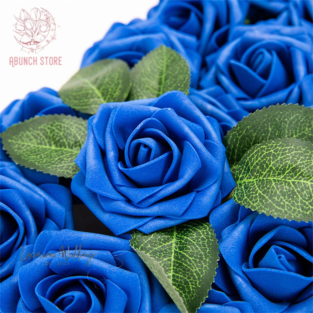 a bunch of blue roses with green leaves