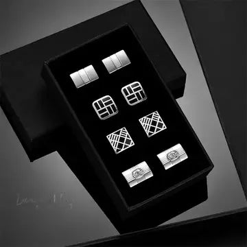 a black box with four pairs of earrings in it