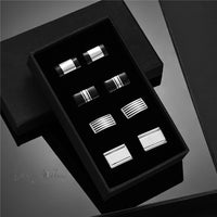 a set of four cufflinks in a black box