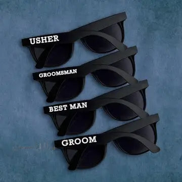 four pairs of sunglasses with the names of grooms and best man
