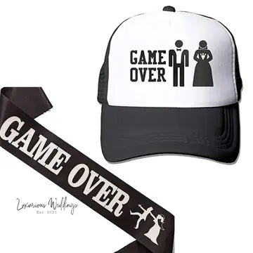 a white and black hat with a game over ribbon