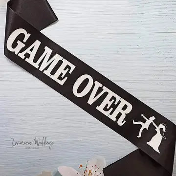 a picture of a game over ribbon on a table