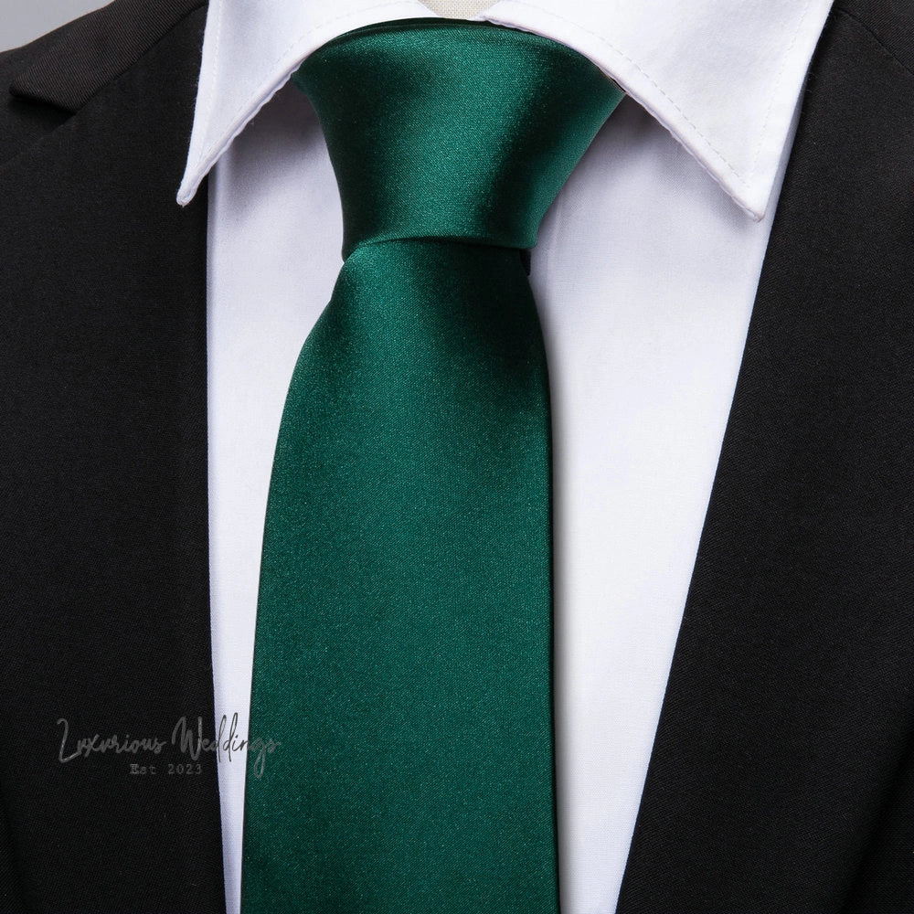 a close up of a person wearing a green tie