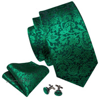 a green tie with matching cufflinks and a pair of cufflinks
