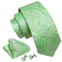 a green tie, cufflinks and a pair of cufflinks