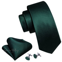 a green tie, cufflinks and a pair of earrings