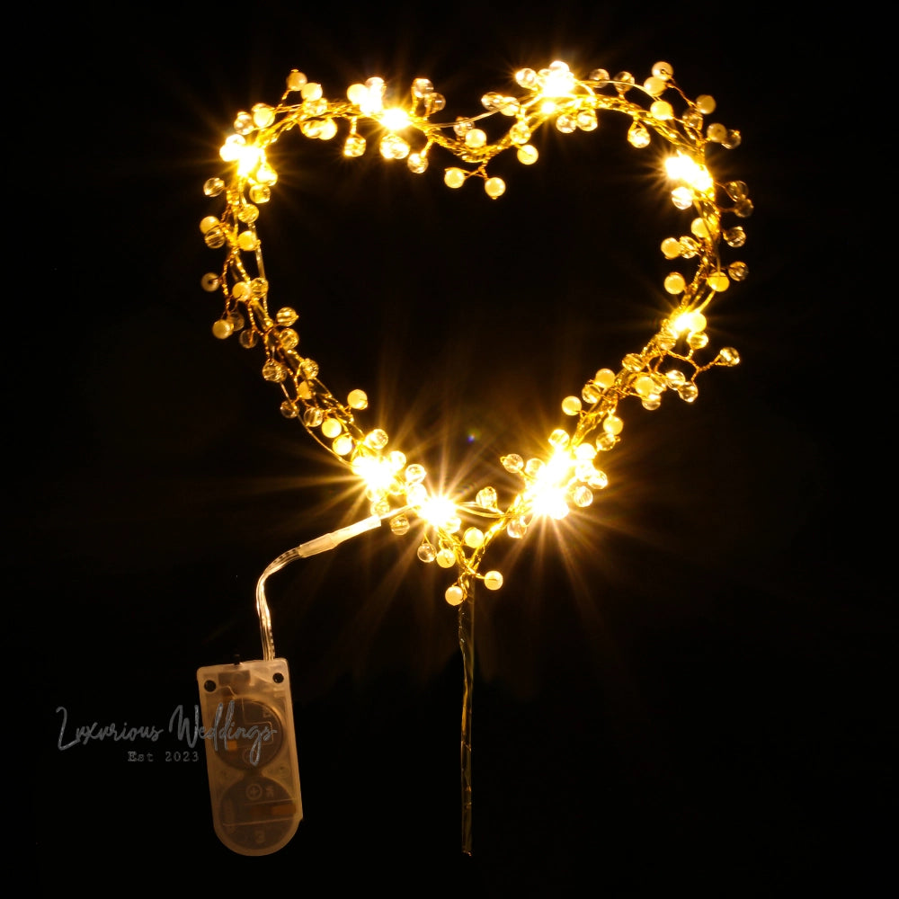 a heart shaped decoration with lights on it