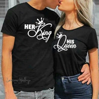 a man and woman kissing while wearing matching shirts