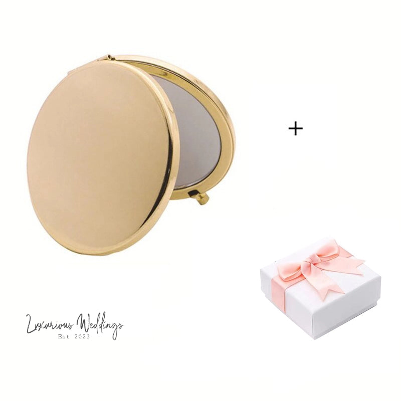 a white box with a pink bow and a mirror