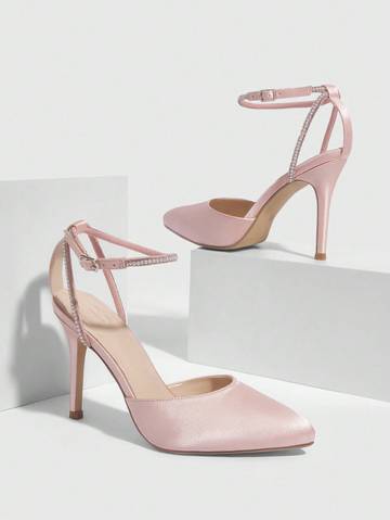 a pair of pink high heels with straps