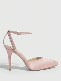 a pair of pink high heeled shoes on a white background