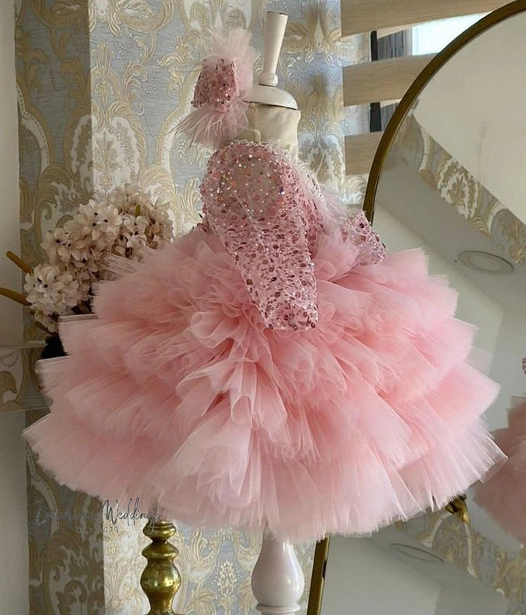 a pink dress on a mannequin in front of a mirror