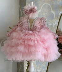 a little girl's pink dress on a mannequin