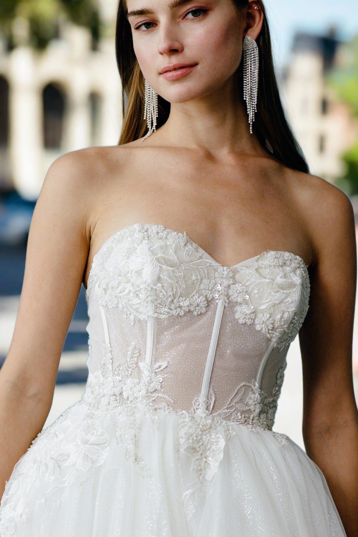 a woman in a wedding dress is posing for a picture