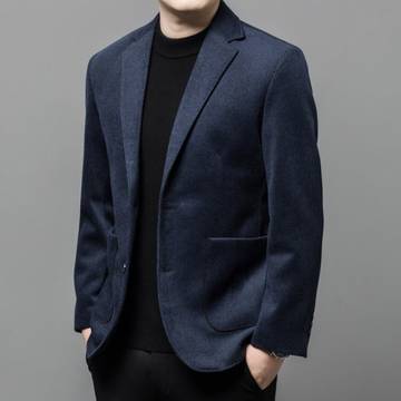 a man in a blue jacket and black shirt