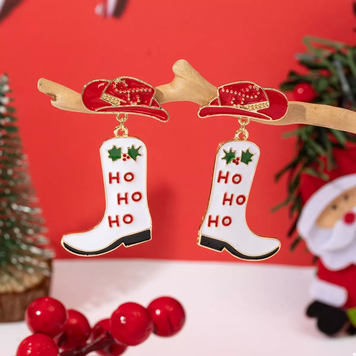 Christmas Cowboy Hat and Boot Dangle Earrings featuring red hat and white boot with 'HO HO HO' design