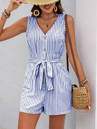 Striped V-neck button front belted romper in blue and white, showcasing a stylish silhouette with pockets.