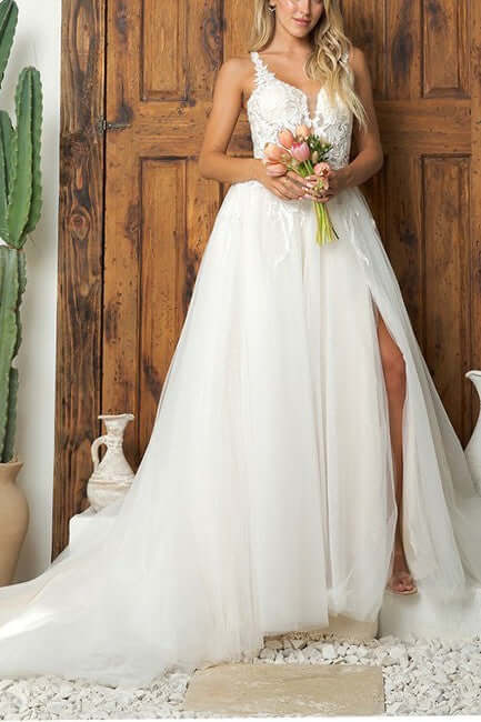 Elegant A-line wedding dress with lace appliqués and chapel train, perfect for the modern bride.