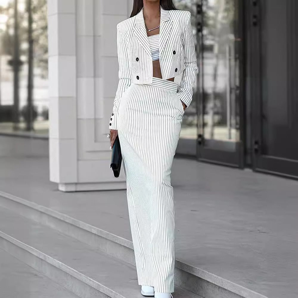 a woman in a white and black striped suit