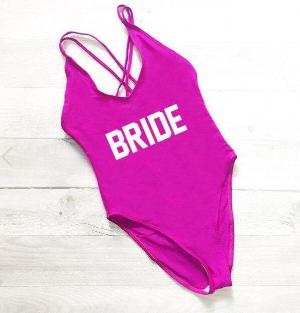 a pink swimsuit with the word bride printed on it