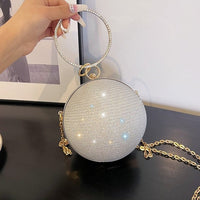Luxurious spherical handbag with diamond embellishments, perfect for elegant weddings and stylish outings.