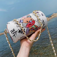 Graffiti cylindrical leather zipper crossbody bag, perfect for luxurious weddings, featuring a cartoon bear design.
