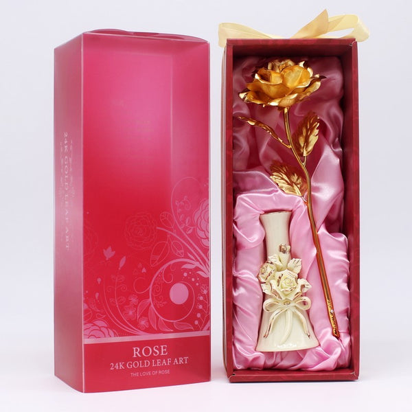 a pink box with a rose inside of it