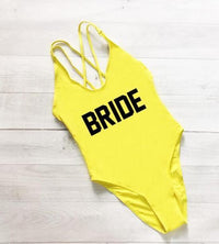 a yellow swimsuit with the word bride printed on it