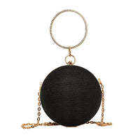 Spherical black handbag with a diamond ring handle and chain, perfect for luxurious weddings and elegant occasions.