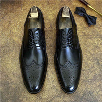 Genuine leather brogue business shoes in sleek black, perfect for formal events and luxurious weddings.