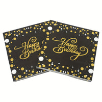 a pair of black and gold happy birthday coasters