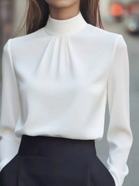 Mock Neck Long Sleeve Blouse with Pleated Detail in white fabric, featuring a sleek design and elegant pleated detail.
