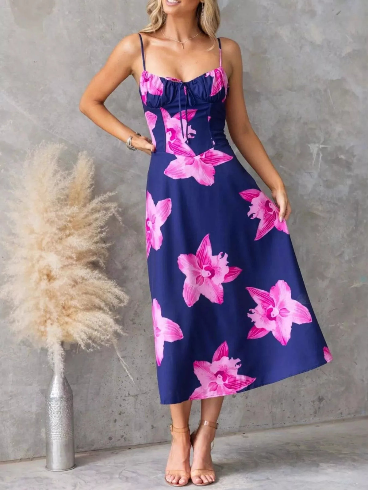 Floral Print Midi Cami Dress featuring bold pink floral design and a stylish ruched bodice on a navy background.