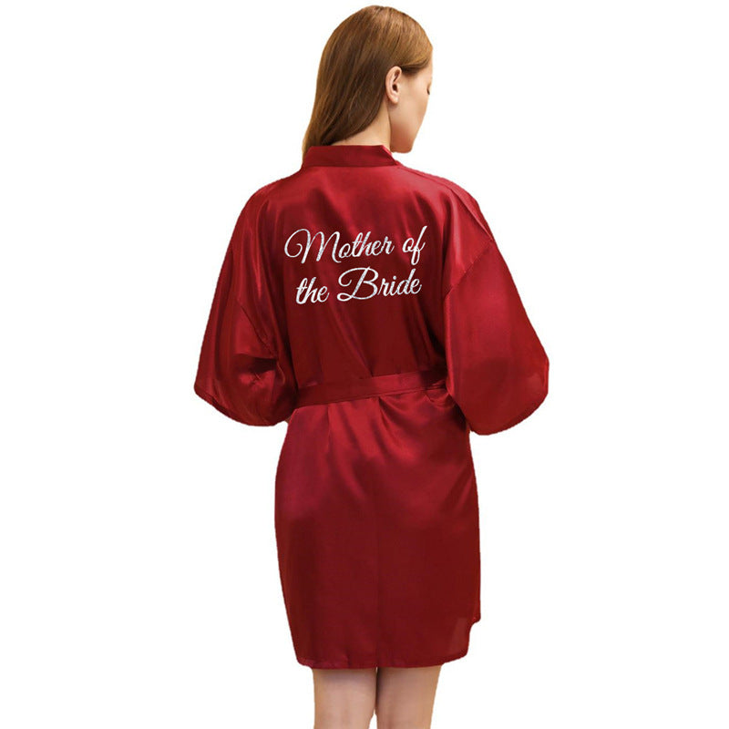 a woman in a red robe that says mother of the bride