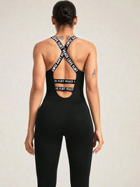 Crisscross back view of a sleeveless black active jumpsuit with stylish straps and a fitted design.