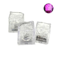 a pair of purple and clear glass cubes