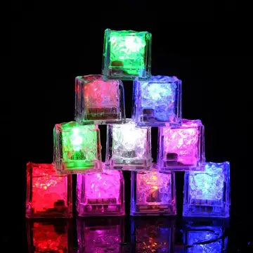 a pile of glowing cubes sitting on top of a table