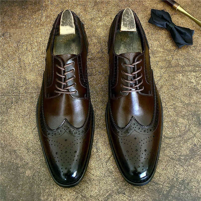 Genuine leather brogue business shoes in dark brown, featuring elegant detailing and pointed toe, ideal for professional attire.