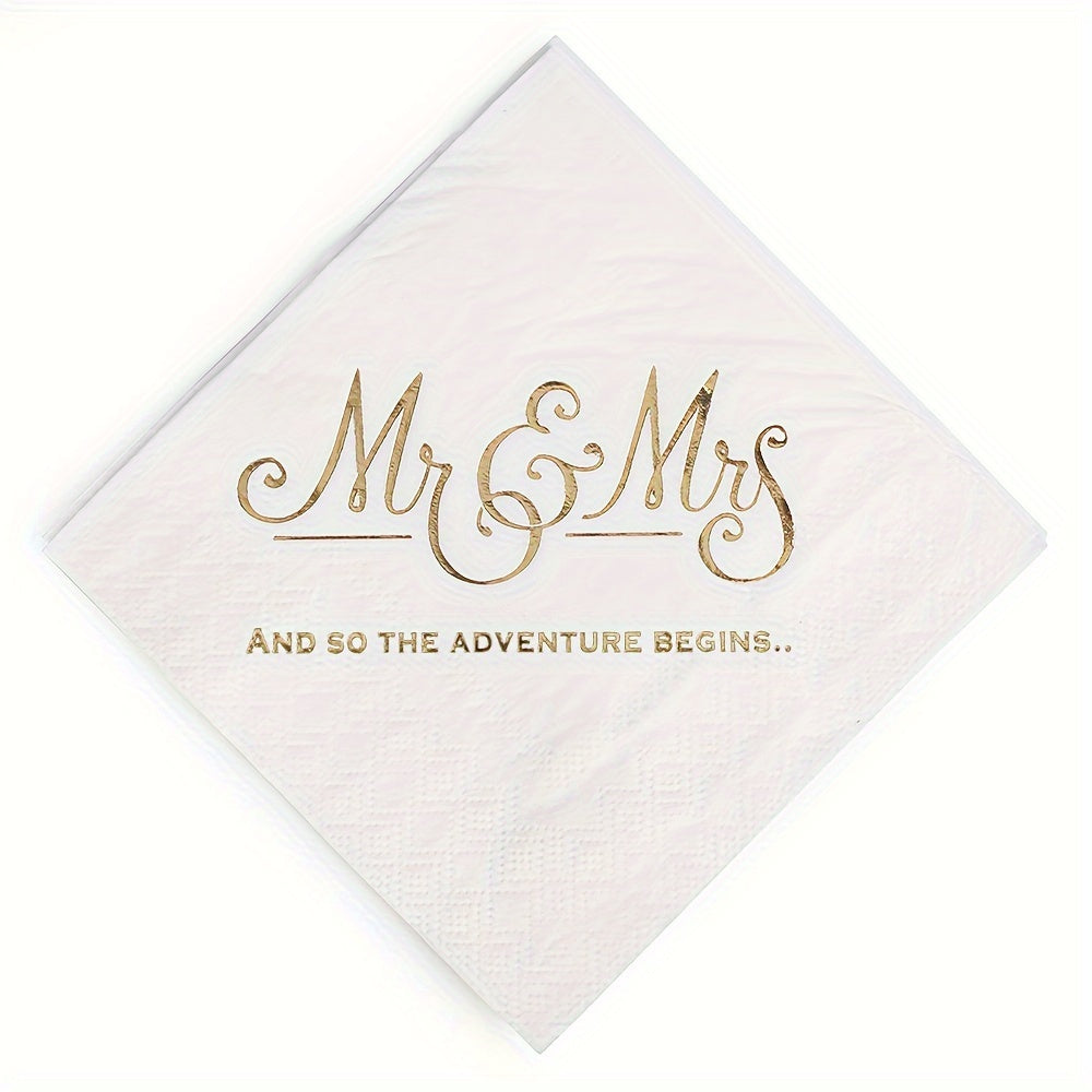 a white napkin with gold lettering on it