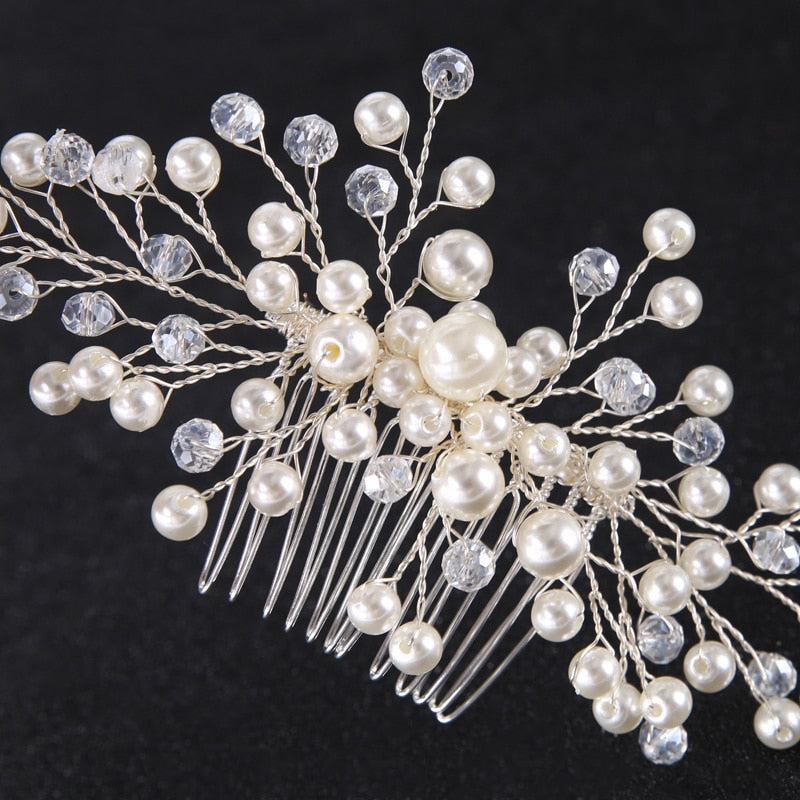 a close up of a hair comb with pearls