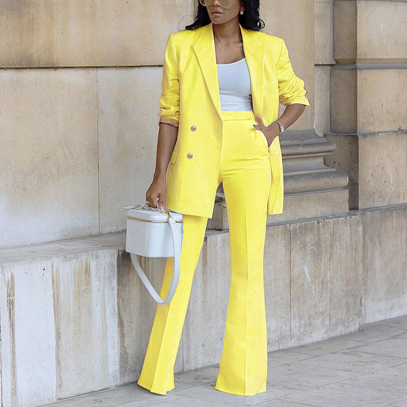 a woman wearing a yellow suit and hat