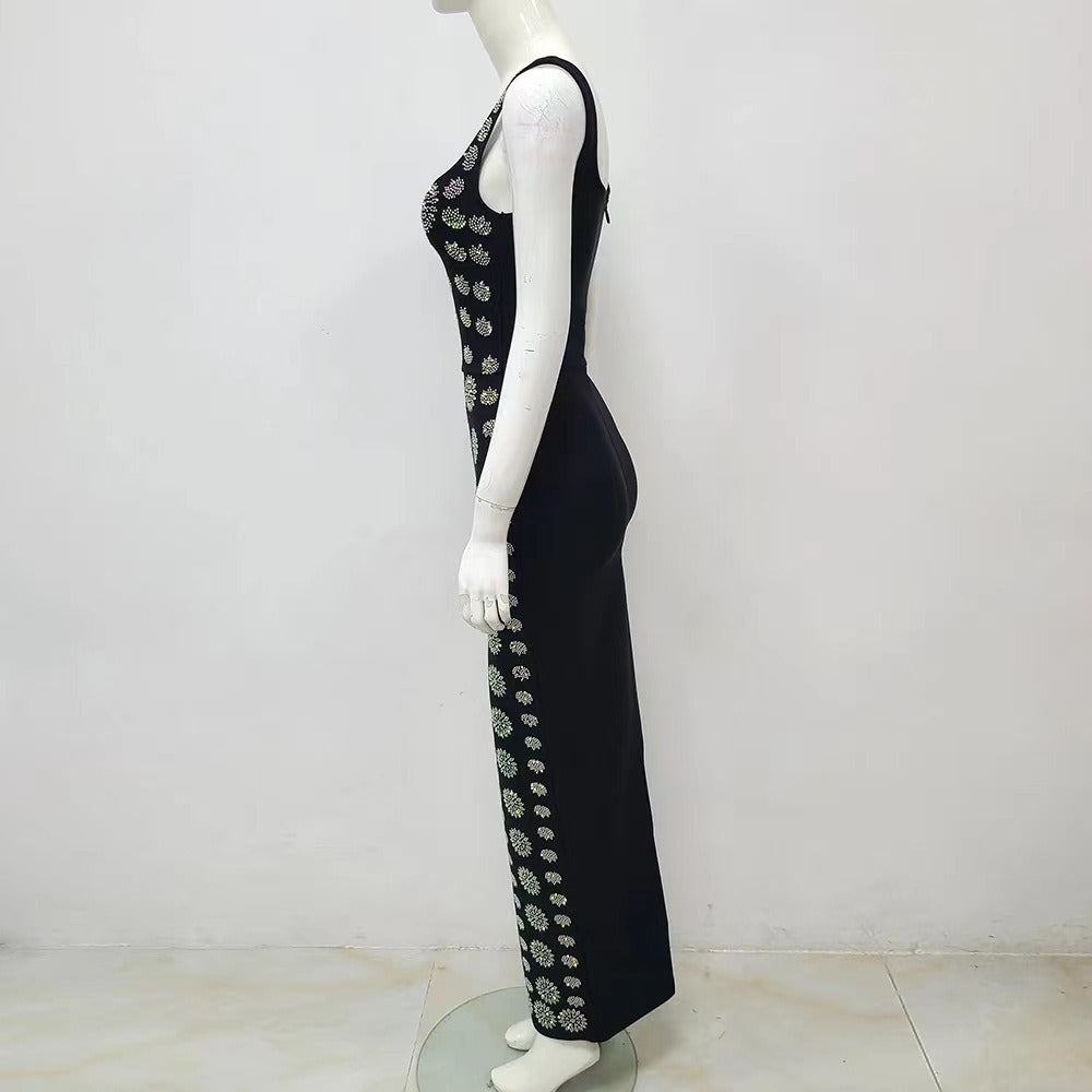 a white mannequin with a black dress on display